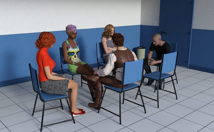 Pessoas reunidas em círculo durante uma atividade de discussão e trabalho coletivo.